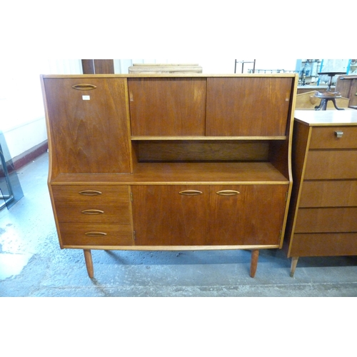 76 - A Jentique teak highboard