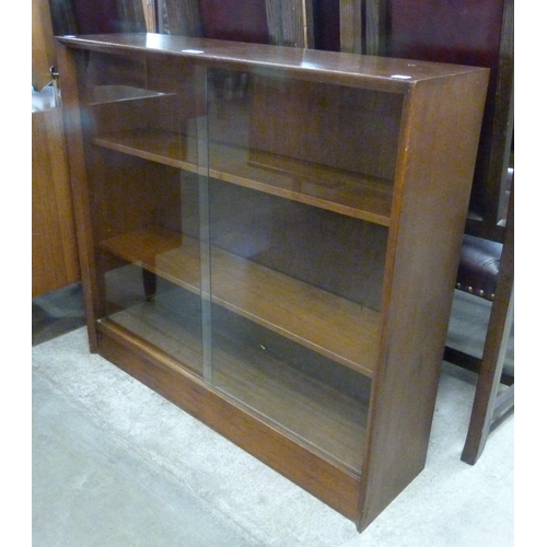 83 - A Herbert Gibbs tola wood bookcase