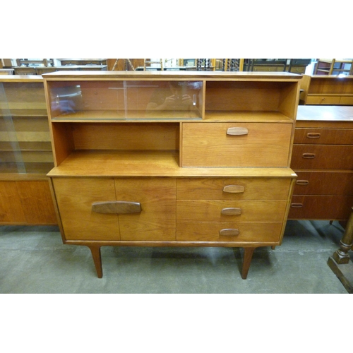 88 - A teak highboard