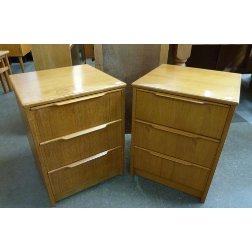 95 - A pair of teak bedside chests