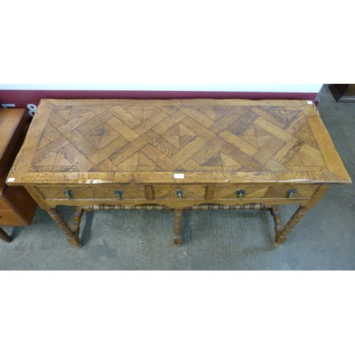 98 - A Queen Anne style oak parquetry top three drawer dresser