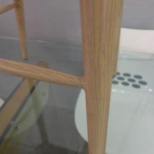 1327A - A pair of natural and black stained oak bar stools with perspex backs