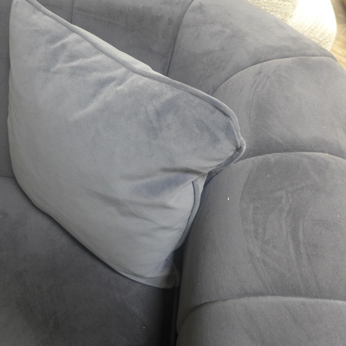 1447 - A grey velvet upholstered shell back three seater sofa