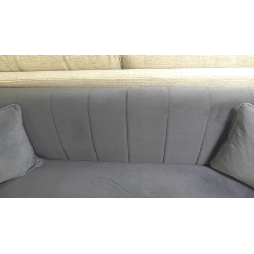 1447 - A grey velvet upholstered shell back three seater sofa