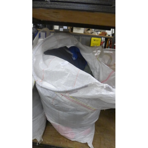 2420 - A large bag of unused coats