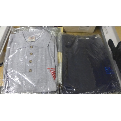 2430 - A box of clothing including workwear, bed sheets and curtains