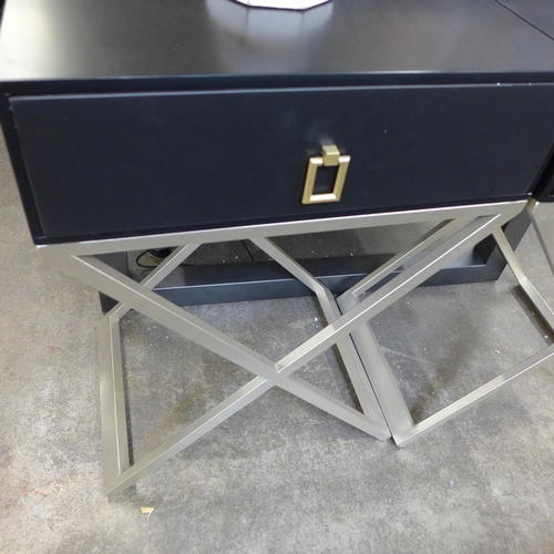 1997 - A pair of black and gold bedside tables