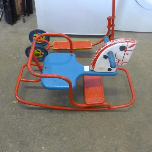 2208 - A metal and wooden vintage rocking horse and a child's scooter