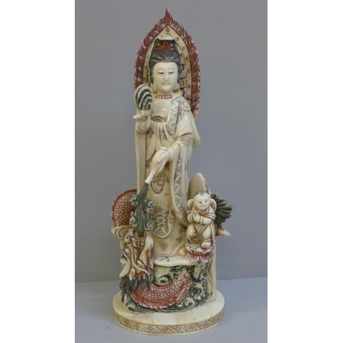 602 - A hand painted Kwan-Yin Mercy Buddha Dragon and Guardian Boy figure, 28cm