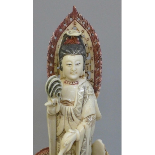 602 - A hand painted Kwan-Yin Mercy Buddha Dragon and Guardian Boy figure, 28cm