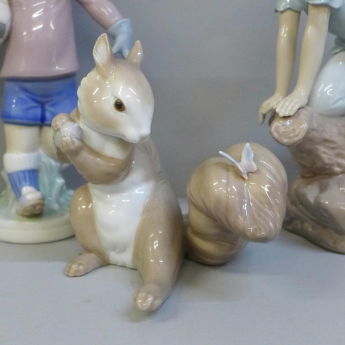 611 - Three Lladro figures; A Surprise Visit, Price of Elves, Boy Football, two boxed