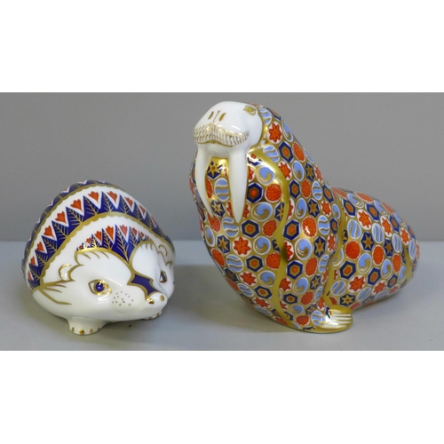 640 - Royal Crown Derby hedgehog and walrus paperweights, walrus with gold stopper, both boxed