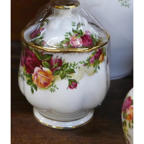 664 - A collection of Royal Albert Old Country Roses including a ginger jar, a bell, a lidded pot, vases, ... 