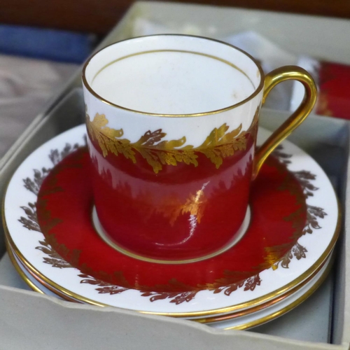 671 - An Aynsley coffee service, boxed and a Poole coffee service