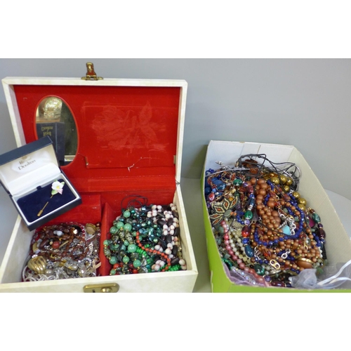 673 - A jewellery case and a box of costume jewellery