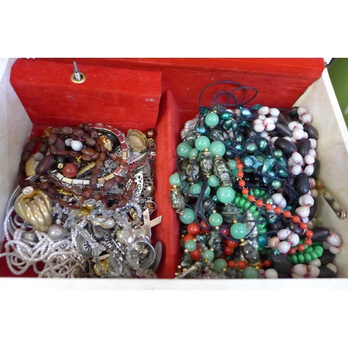 673 - A jewellery case and a box of costume jewellery