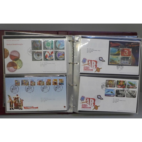 685 - An album of stamp first day covers, 2000s, British Design Classics, Darwin, Post Boxes, Mammals, Com... 