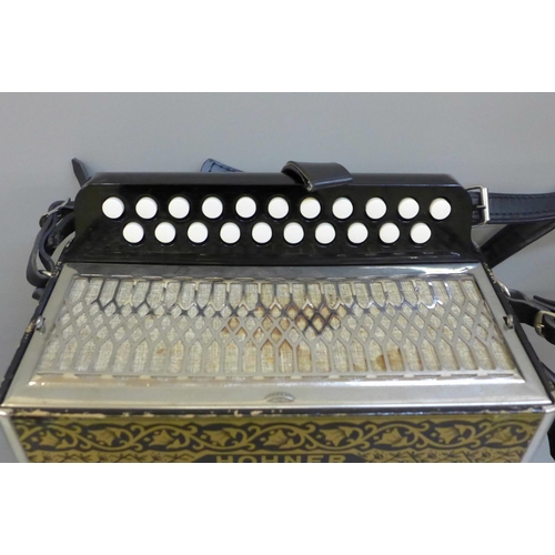 700 - A Hohner 2815 Vienna Pokerwork two-row diatronic accordion with shoulder straps, cased