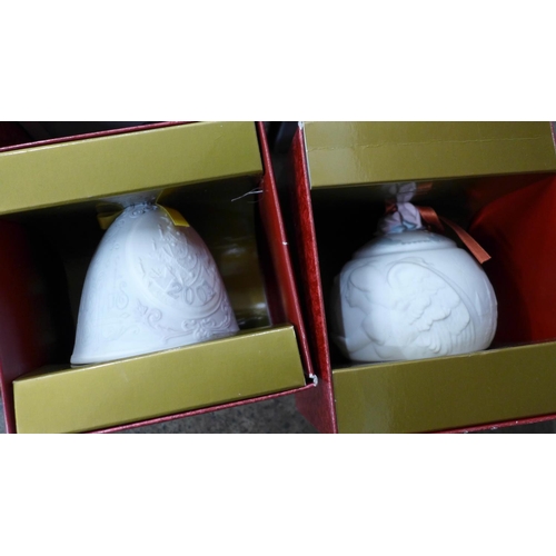 702 - Fourteen Lladro Christmas bells, boxed, etc.