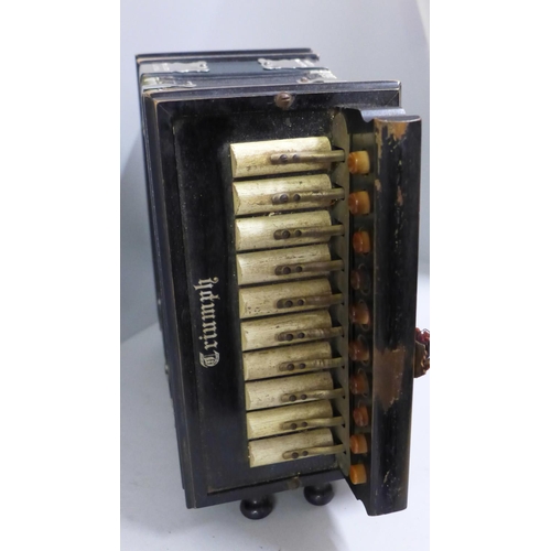 703 - A Triumph Accordion Action Squeeze box