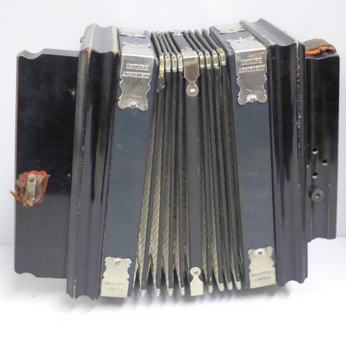 703 - A Triumph Accordion Action Squeeze box