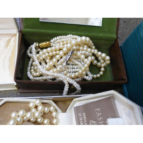 717 - Two boxes of costume jewellery and simulated pearls