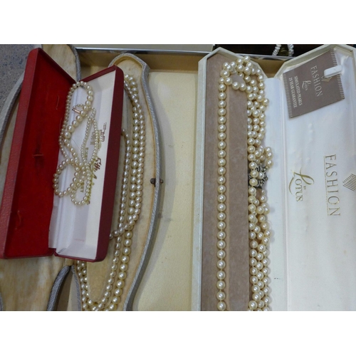 717 - Two boxes of costume jewellery and simulated pearls