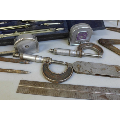 729 - Two Moore & Wright micrometers, drawing tools, two tape measures, etc.