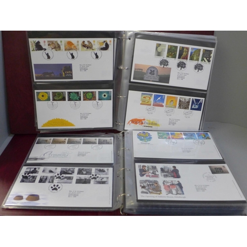 744 - Stamps; two Royal Mail First Day Covers albums containing covers spanning the period 1994 to 2005