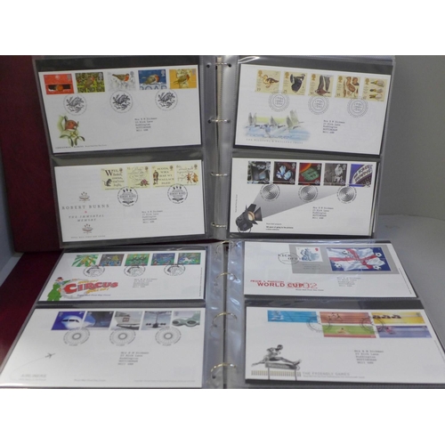 744 - Stamps; two Royal Mail First Day Covers albums containing covers spanning the period 1994 to 2005