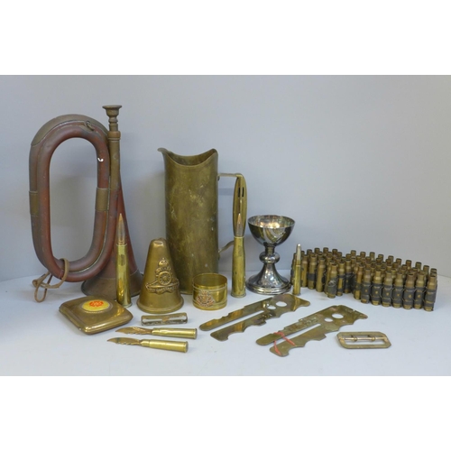 Militaria; a bugle, a brass trench art shell case, a Lancaster Division  cigarette case, etc.