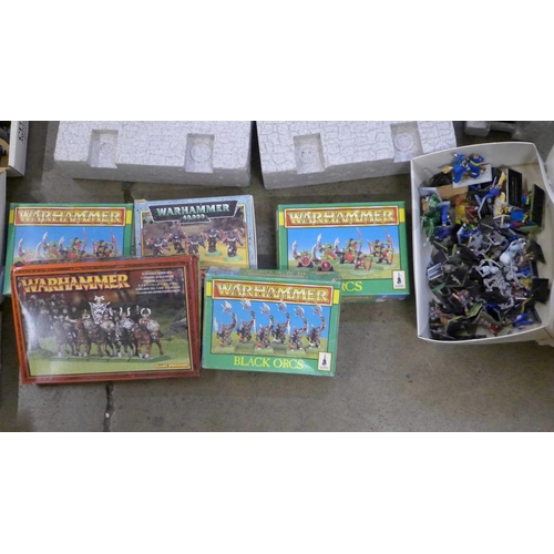 756 - A large collection of Warhammer figures in associated boxes and a polystyrene castle