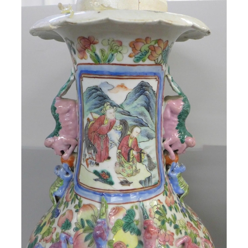 771 - A 19th Century Chinese export famille rose large temple vase, rim restored, 64cm