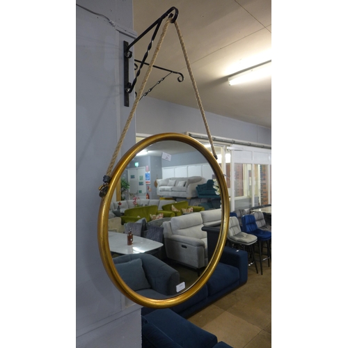 1315 - A large round gold mirror on a hanging rope H58cm (JRG1114)