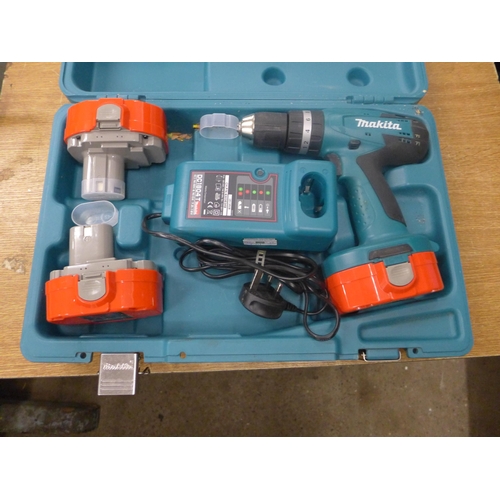 2063 - A Makita drill (model no. 83191D) with charger and two batteries