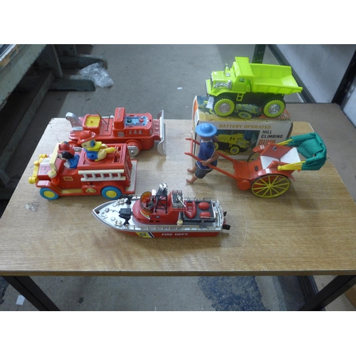 2079 - Toys including Marx Hill climbing dump truck, Disney fire engine, Fire Department boat, a boxed bull... 