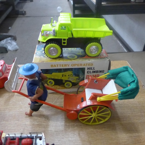 2079 - Toys including Marx Hill climbing dump truck, Disney fire engine, Fire Department boat, a boxed bull... 