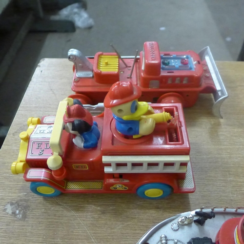 2079 - Toys including Marx Hill climbing dump truck, Disney fire engine, Fire Department boat, a boxed bull... 