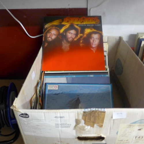 2176 - A box of approx. 70 LPs and 20 singles including Bee Gees, Eagles, classical and musicals