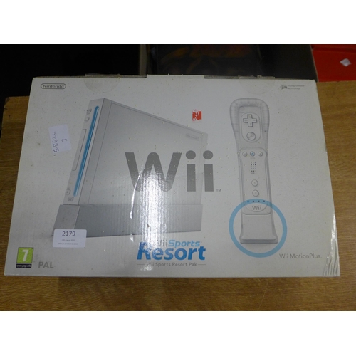 2179 - A Wii console with balance board and games,
Mario karts and wii sorts