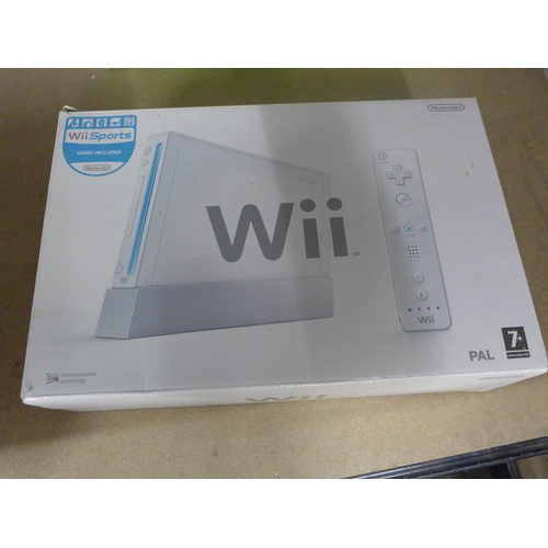 2179 - A Wii console with balance board and games,
Mario karts and wii sorts