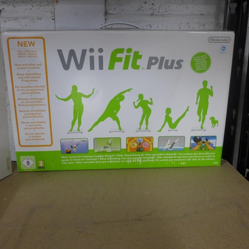 2179 - A Wii console with balance board and games,
Mario karts and wii sorts