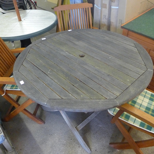 2226 - A wooden table and four garden chairs