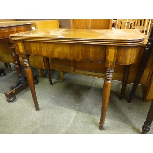 120 - A George IV inlaid mahogany D-shaped fold over tea table