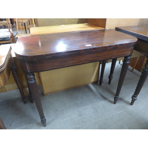 121 - A Regency inlaid mahogany D-shaped fold over card table