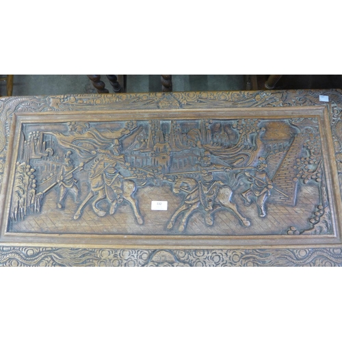 132 - A Chinese camphorwood blanket box, the top with carved Battle of Tiger Gate scene