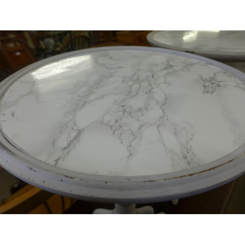 159 - A pair of painted tripod wine tables, with faux marble tops