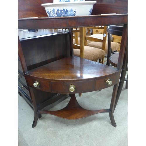 163 - A George III mahogany corner washstand, with blue and white porcelain jug, bowl and soap dishes