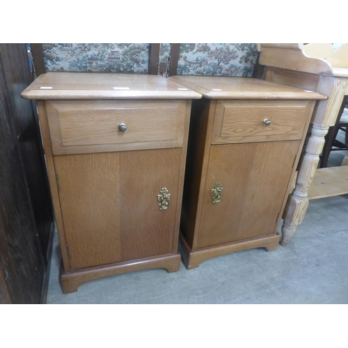 195 - A pair of Stag oak bedside cabinets