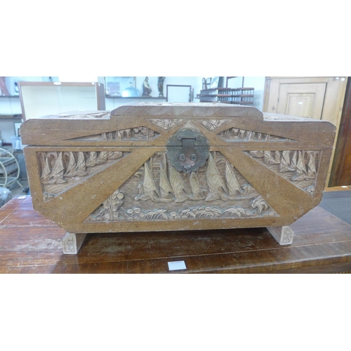 204 - An oriental carved camphorwood blanket box